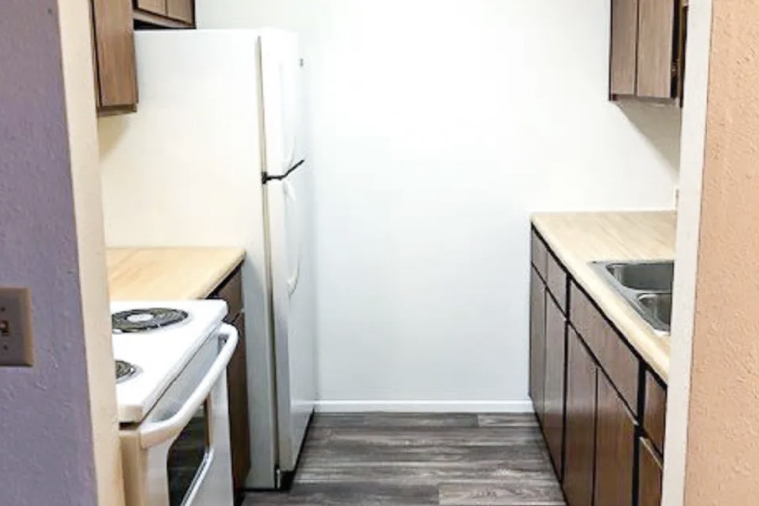 100 West Mill Pond Brooklyn, MI 49230 - Photo 8 of 11 a view of a kitchen from the hallway