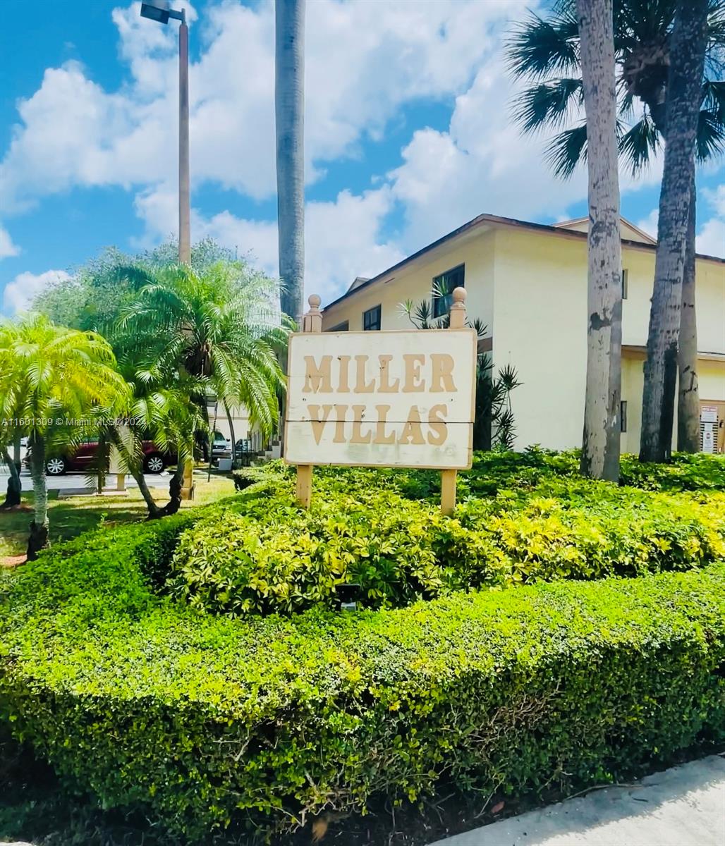 6475 Southwest 129th Place, Unit 4034 Miami, FL 33183 - Photo 1 of 15 a sign on the side of a building