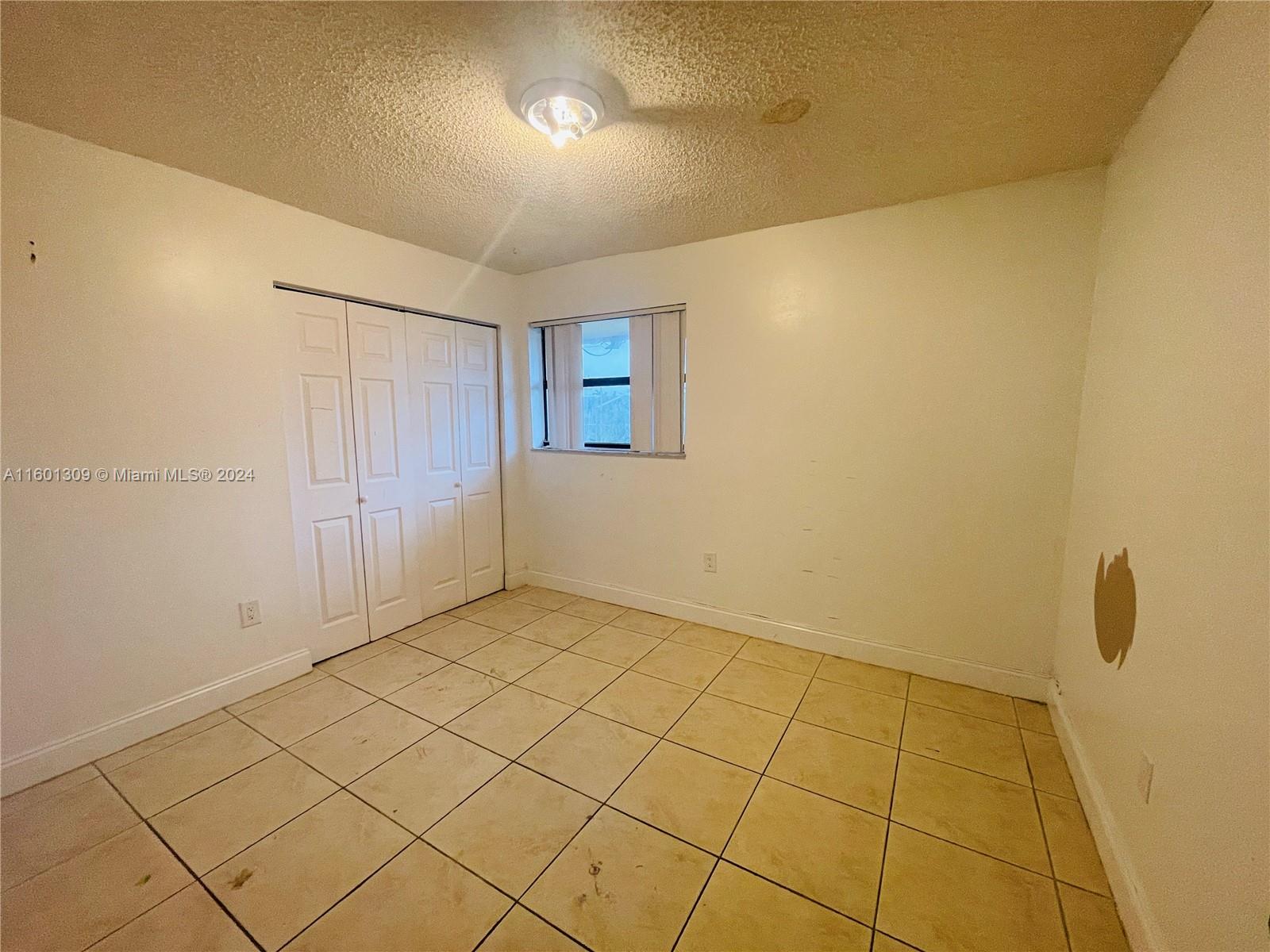 6475 Southwest 129th Place, Unit 4034 Miami, FL 33183 - Photo 14 of 15 a view of an empty room