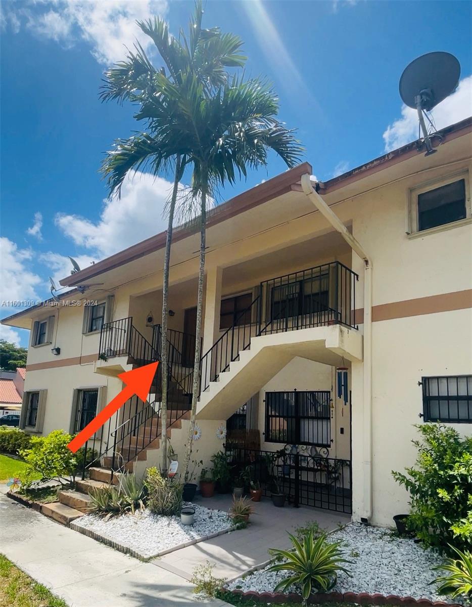 6475 Southwest 129th Place, Unit 4034 Miami, FL 33183 - Photo 3 of 15 a front view of a house with balcony