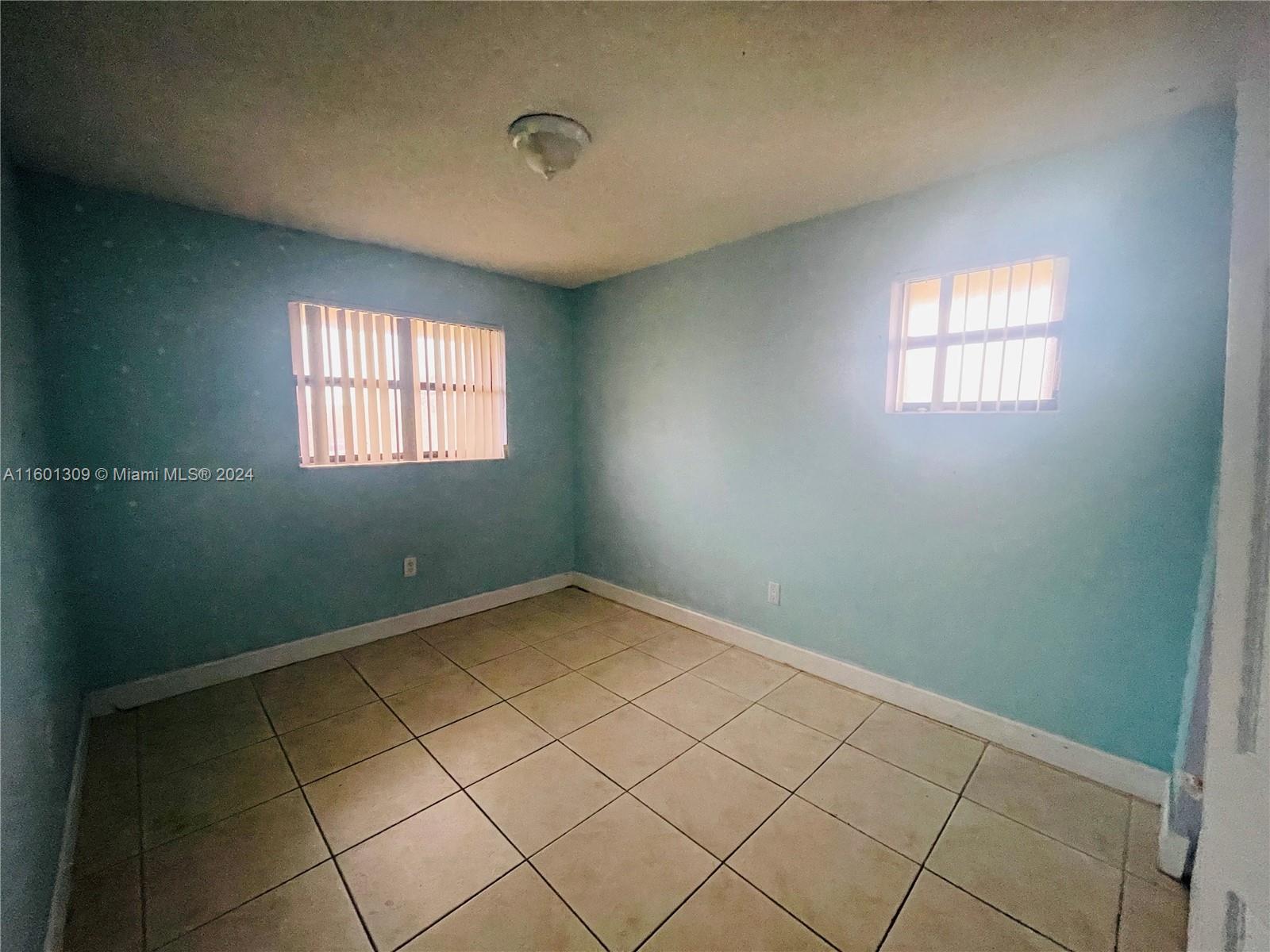 6475 Southwest 129th Place, Unit 4034 Miami, FL 33183 - Photo 10 of 15 an empty room with windows