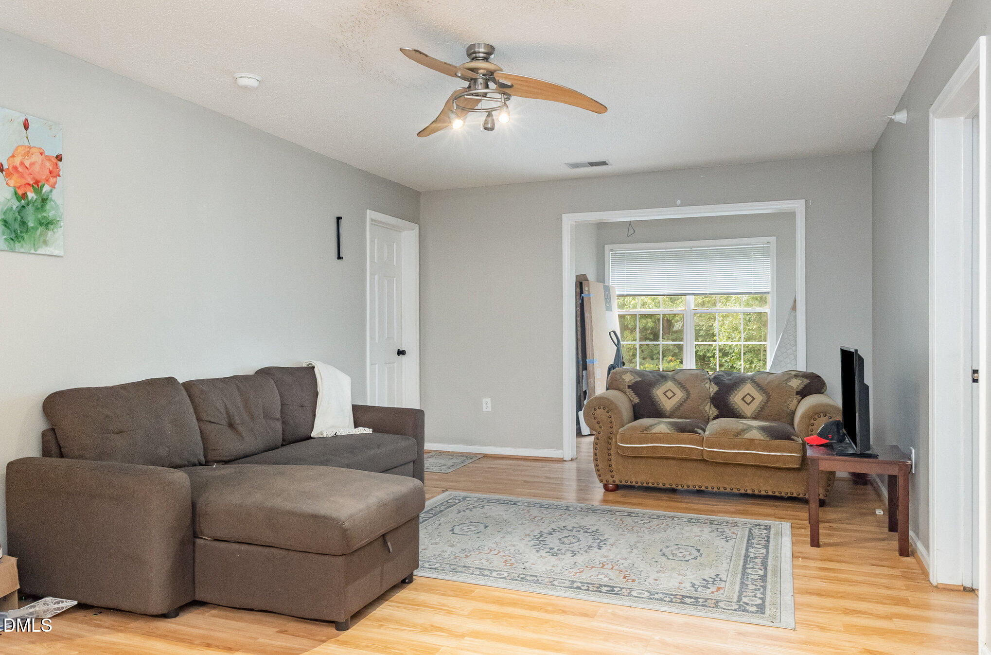 2011 Wolfmill Drive, Unit 301 Raleigh, NC 27603 - Photo 3 of 12 a living room with furniture and a couch