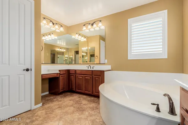 a bathroom with a bathtub and a toilet
