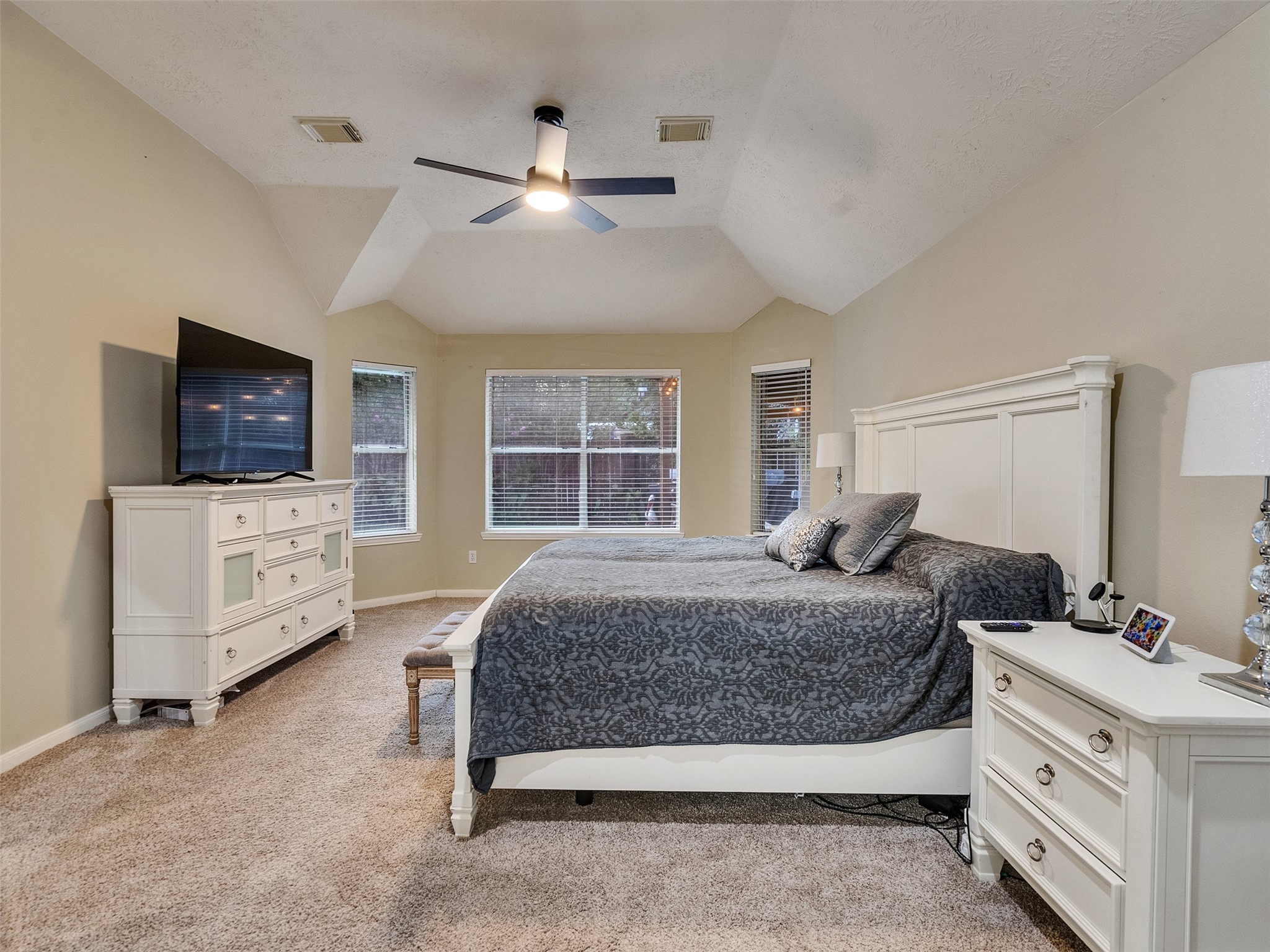 8806 Granite Gorge Drive Spring, TX 77379 - Photo 17 of 28 a bedroom with a bed a couch and flat tv screen