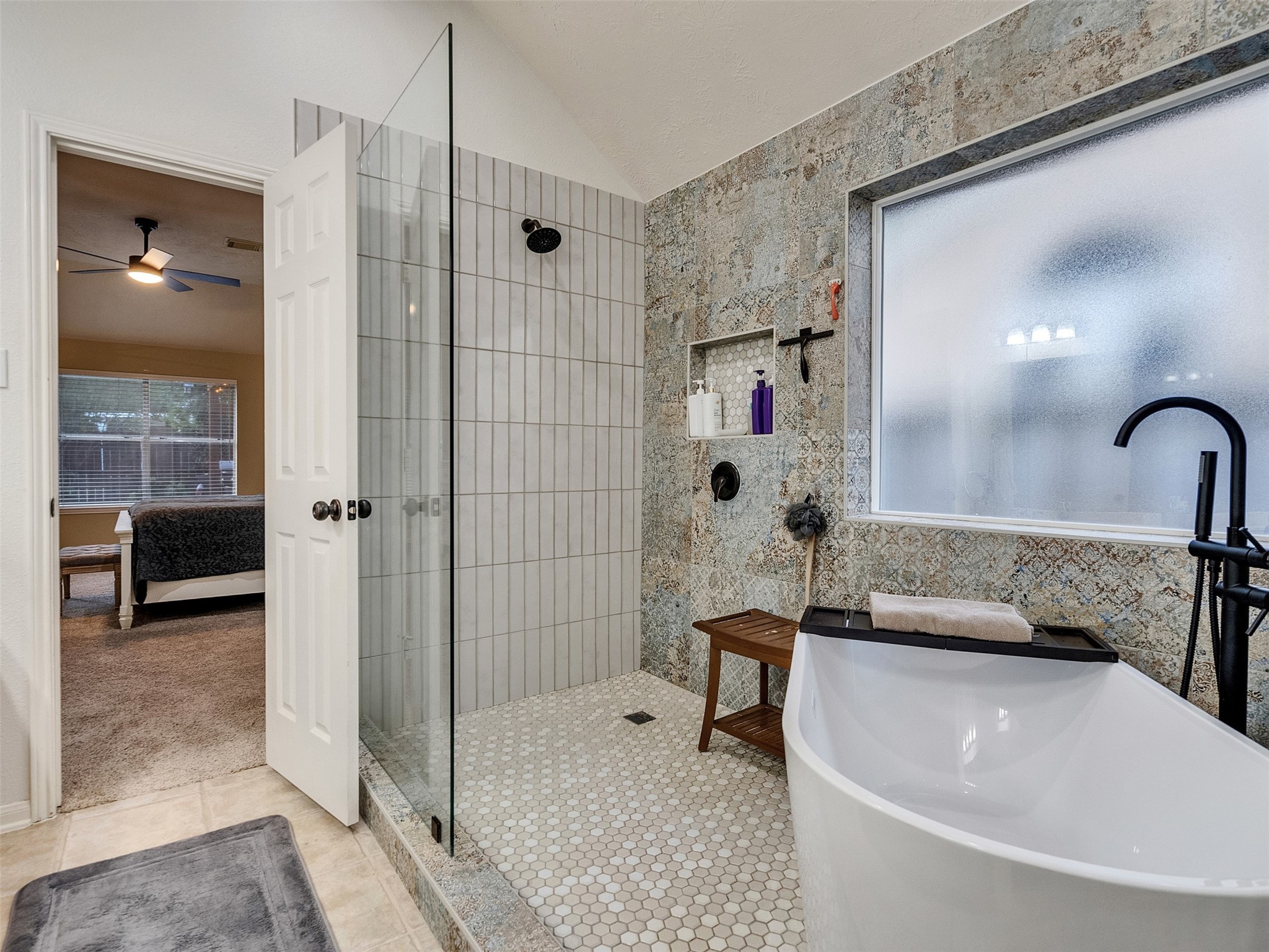 8806 Granite Gorge Drive Spring, TX 77379 - Photo 18 of 28 a bathroom with a tub shower and sink