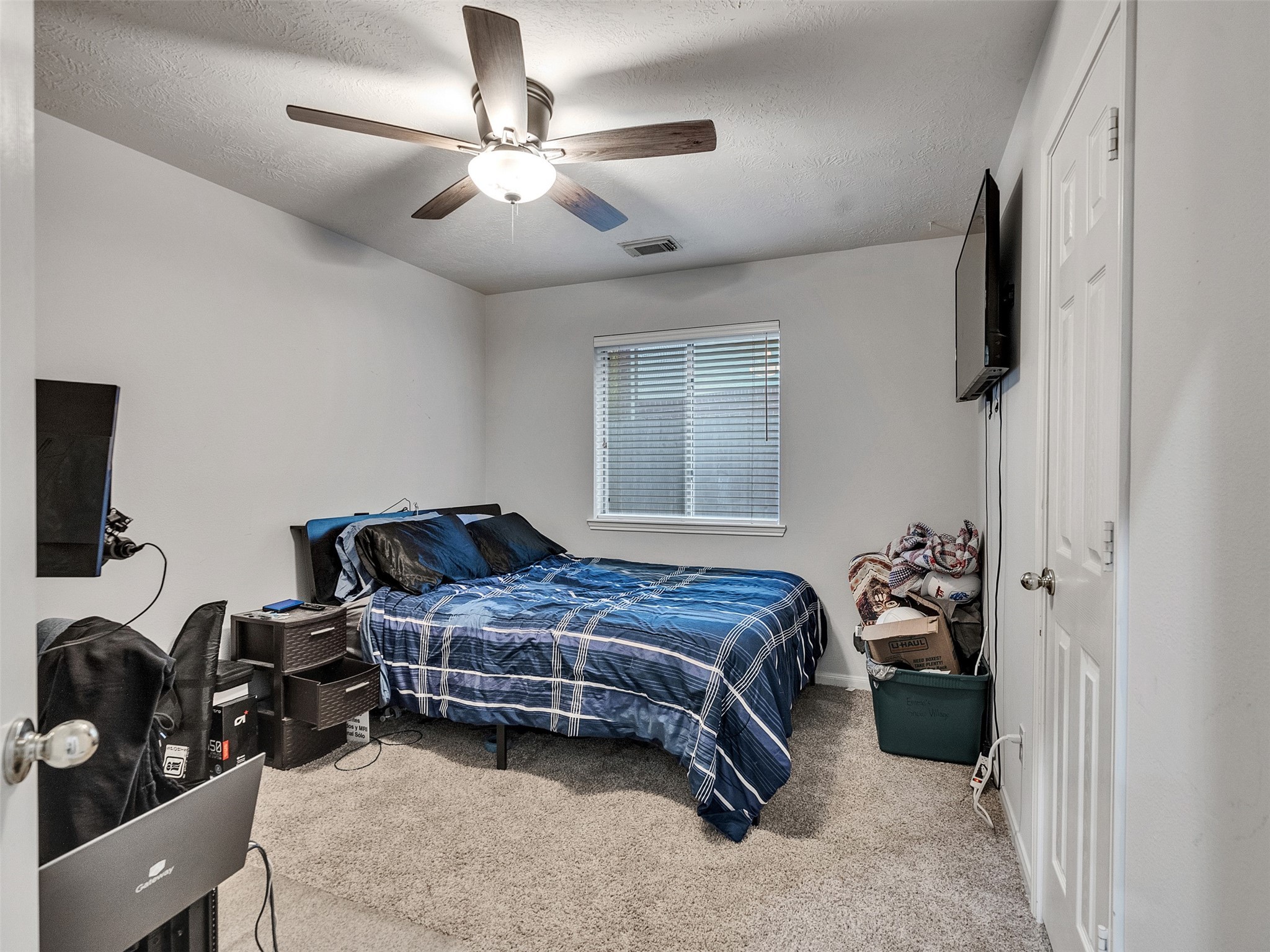 8806 Granite Gorge Drive Spring, TX 77379 - Photo 20 of 28 a bedroom with a bed and a tv