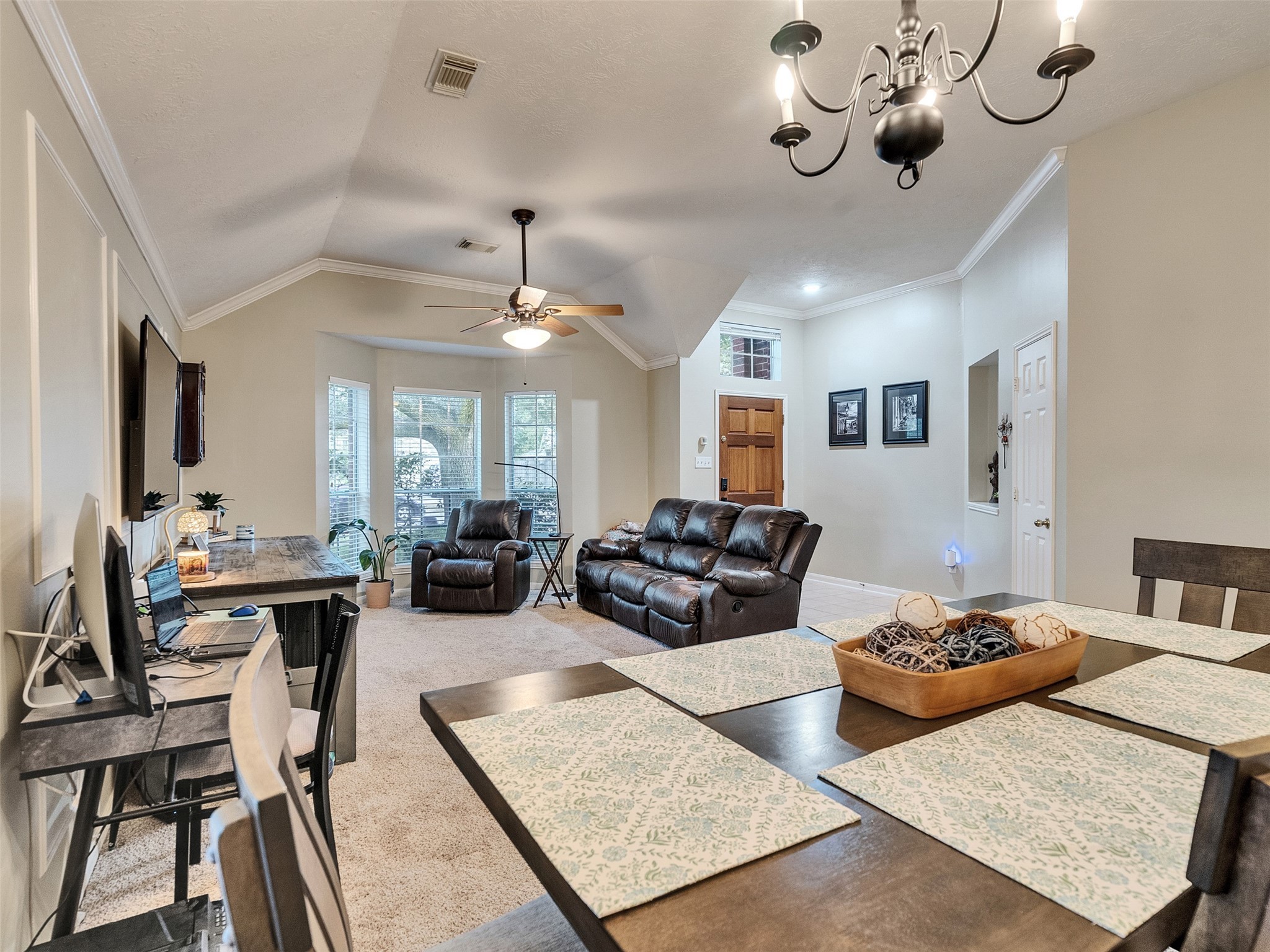 8806 Granite Gorge Drive Spring, TX 77379 - Photo 2 of 28 a living room with furniture kitchen view and a chandelier