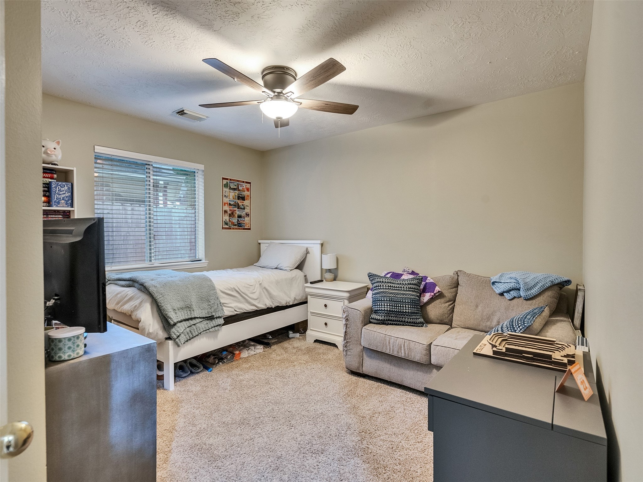 8806 Granite Gorge Drive Spring, TX 77379 - Photo 21 of 28 a bedroom with furniture and a chandelier