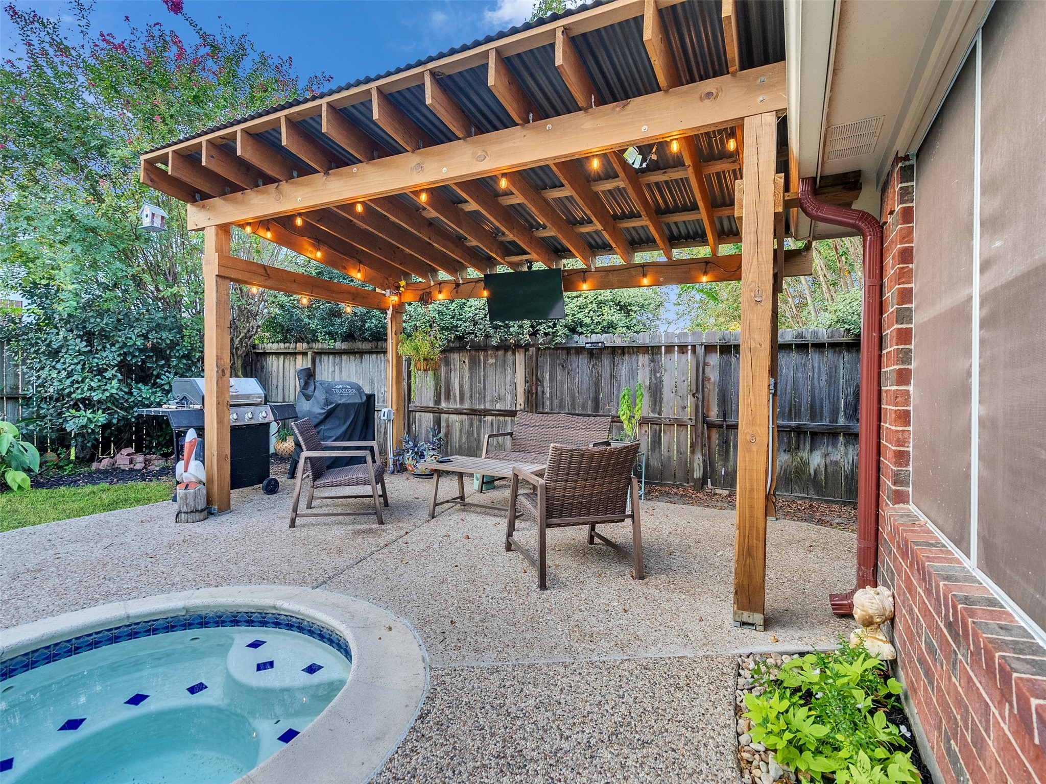 8806 Granite Gorge Drive Spring, TX 77379 - Photo 27 of 28 a backyard of a house with table and chairs