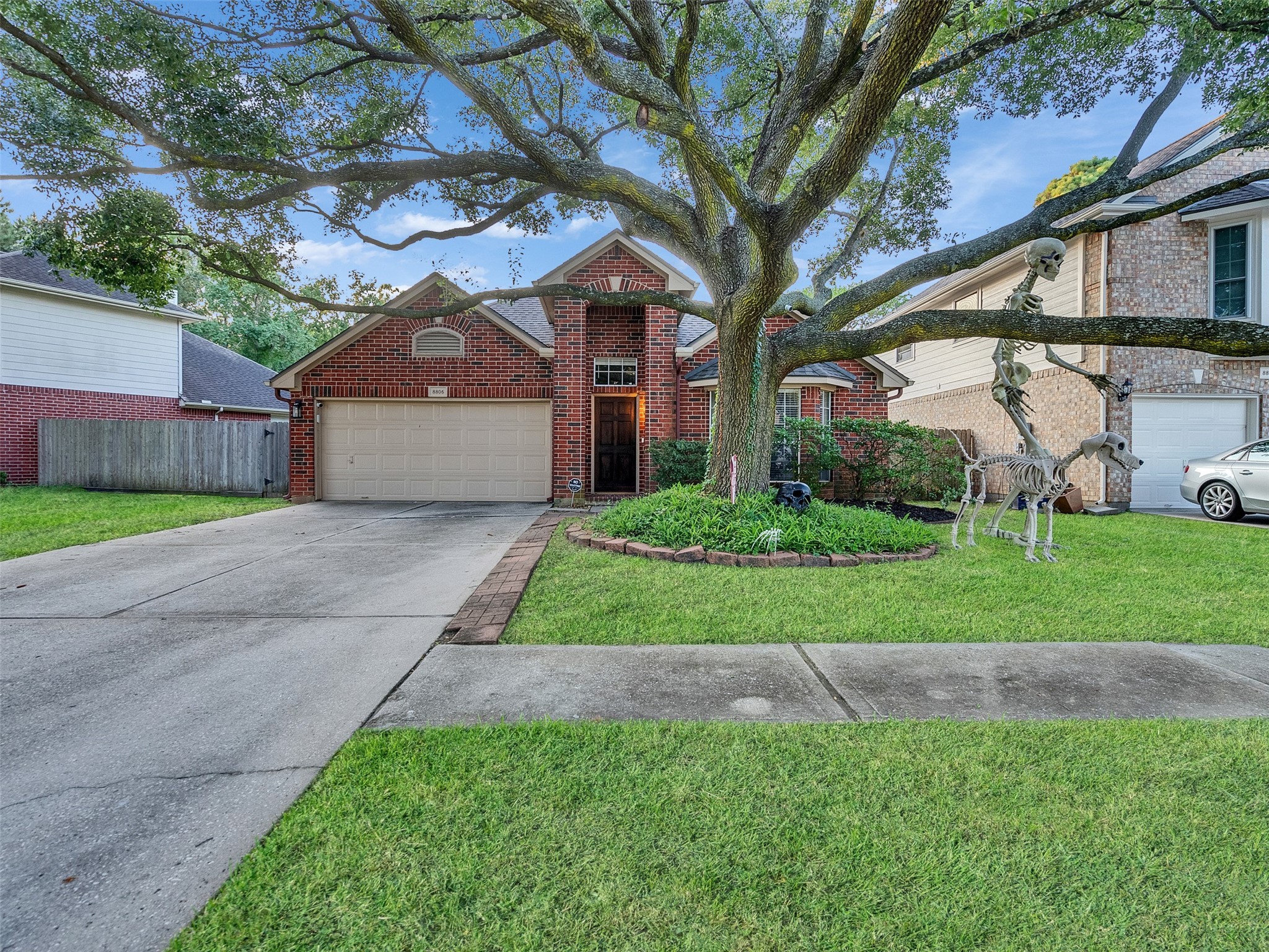 8806 Granite Gorge Drive Spring, TX 77379 - Photo 28 of 28 a front view of a house with a yard and garage