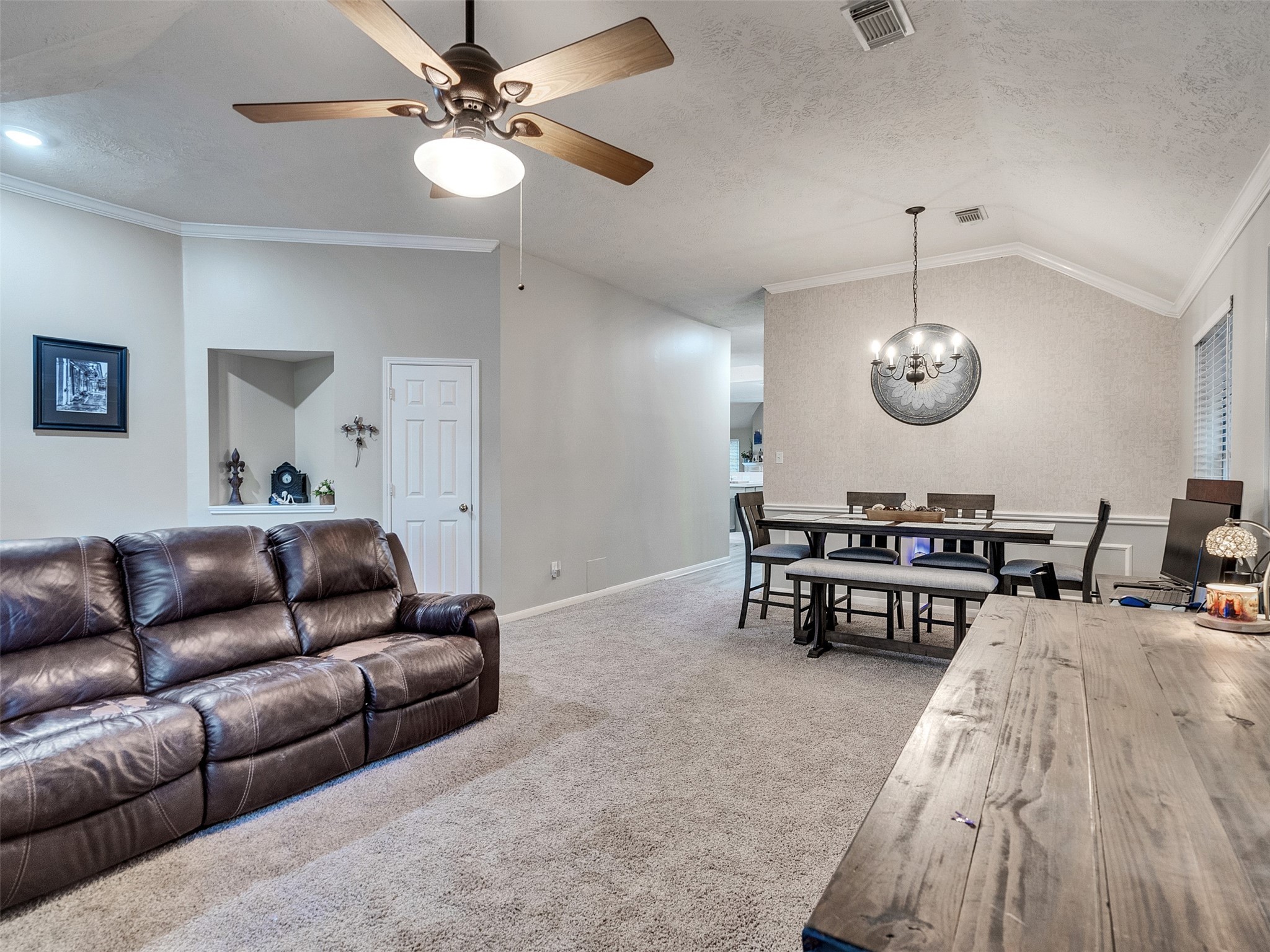 8806 Granite Gorge Drive Spring, TX 77379 - Photo 3 of 28 a living room with furniture a clock and a ceiling fan