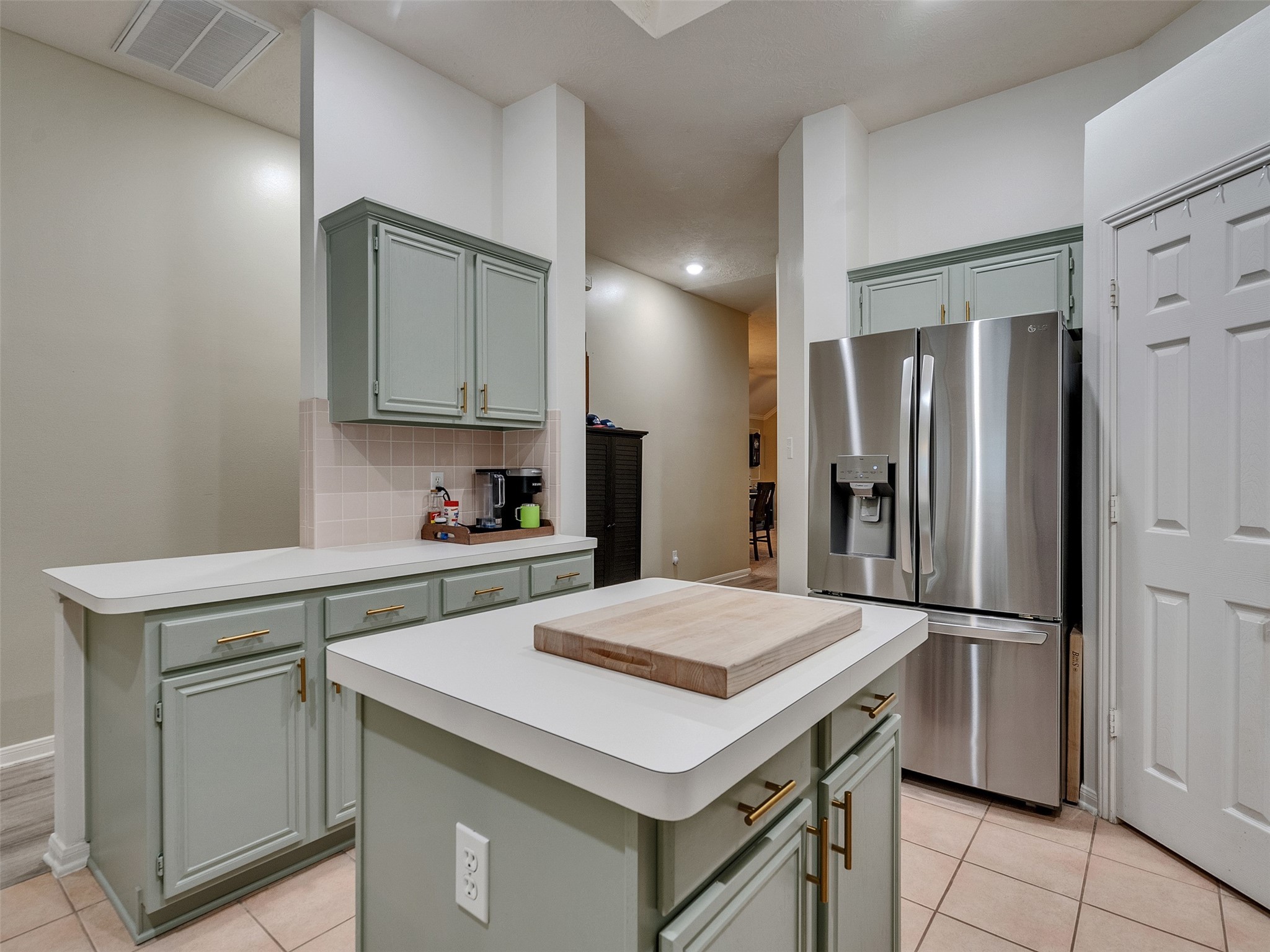 8806 Granite Gorge Drive Spring, TX 77379 - Photo 8 of 28 a kitchen with a sink a refrigerator and cabinets