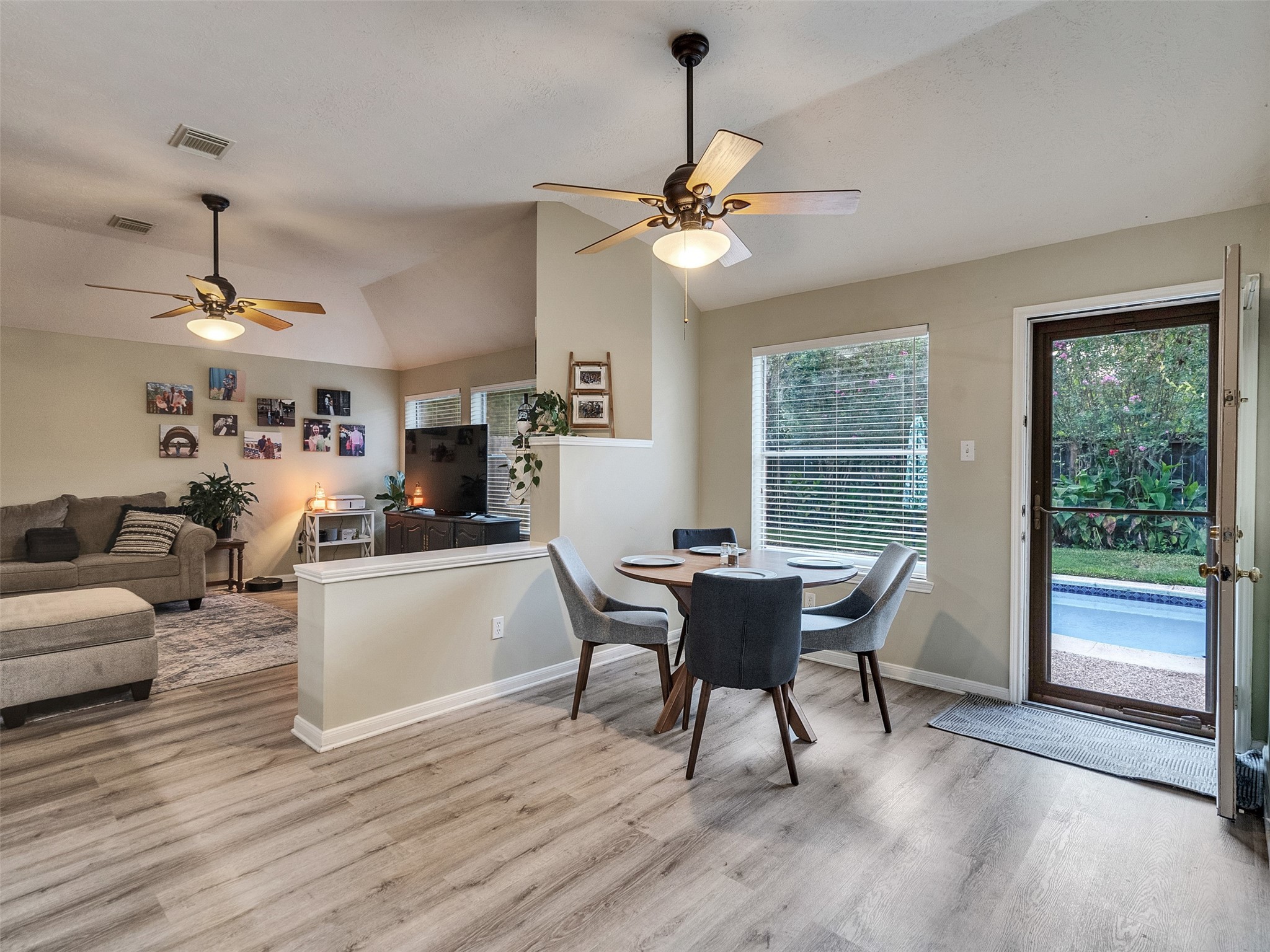 8806 Granite Gorge Drive Spring, TX 77379 - Photo 9 of 28 a view of a dining room with furniture window and wooden floor