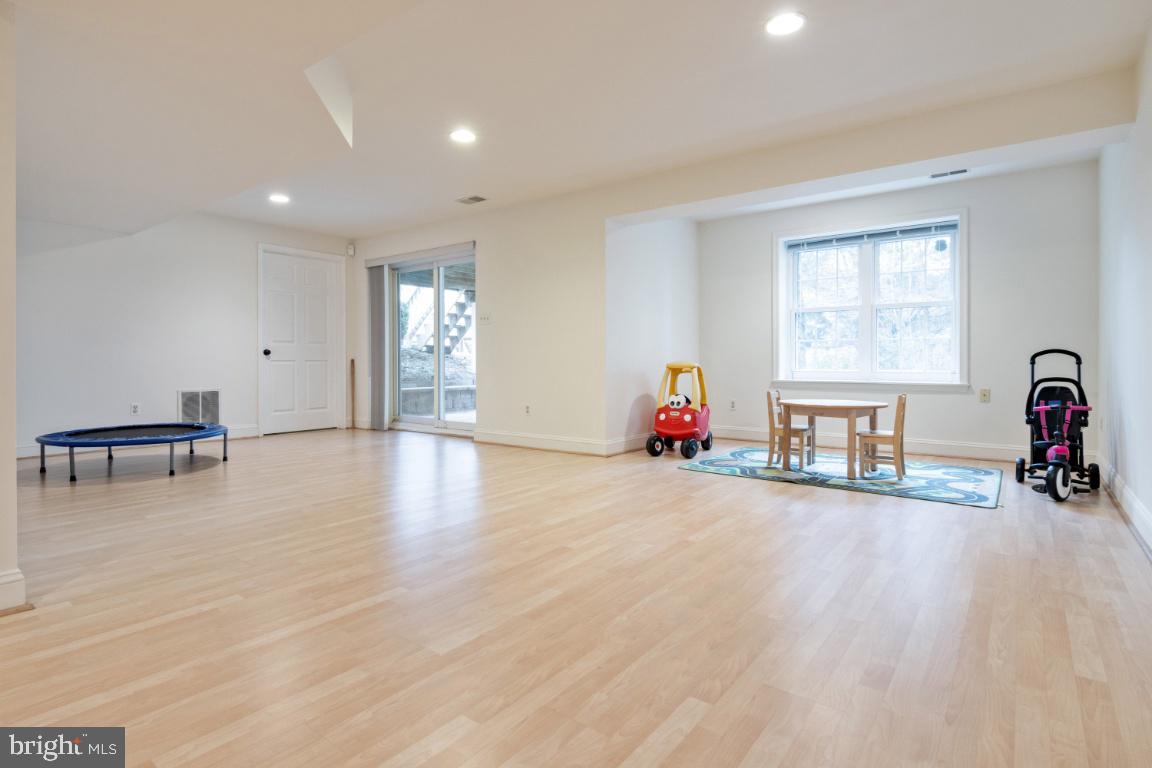 9717 Rugby Court Ellicott City, MD 21042 - Photo 37 of 59 Lower level rec room with slider to paver patio