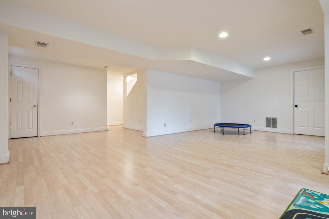 9717 Rugby Court Ellicott City, MD 21042 - Photo 38 of 59 Rec room with laminate floors