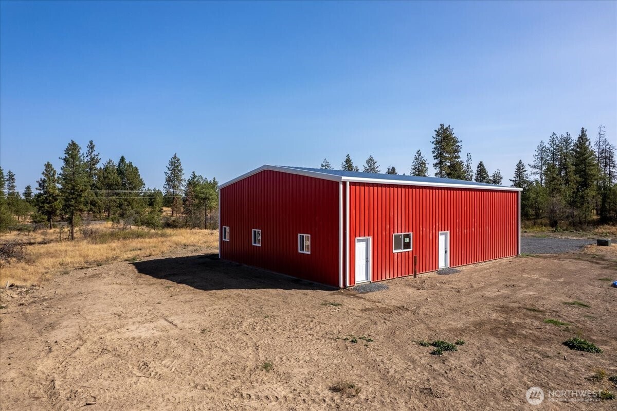 35000 Miles Creston Road North Creston, WA 99117 - Photo 11 of 26 a view of a field with a tree in front of it