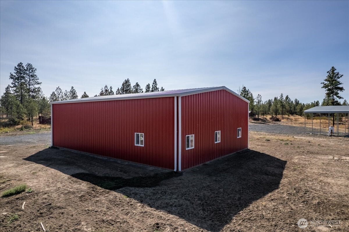 35000 Miles Creston Road North Creston, WA 99117 - Photo 12 of 26 a view of a backyard with a barn