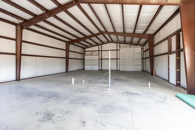 a view of an empty room with a staircase