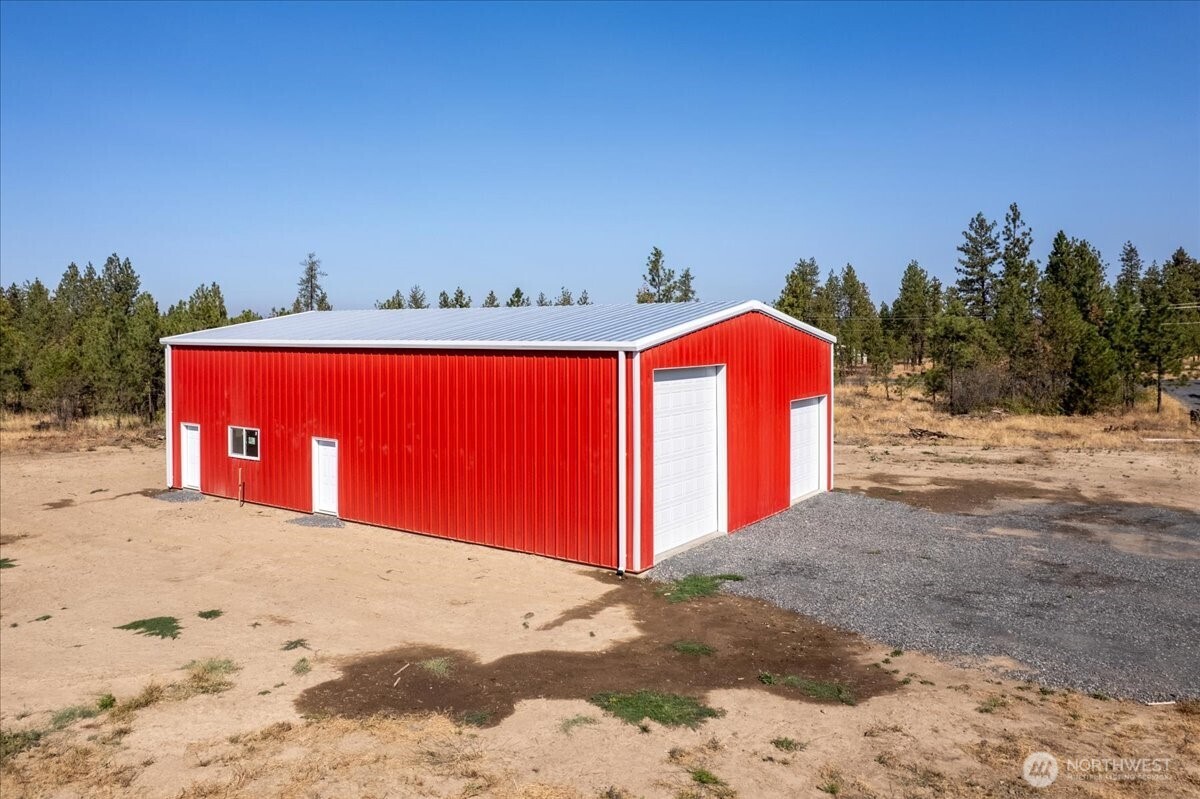 35000 Miles Creston Road North Creston, WA 99117 - Photo 9 of 26 a view of a dry yard with a house in the background
