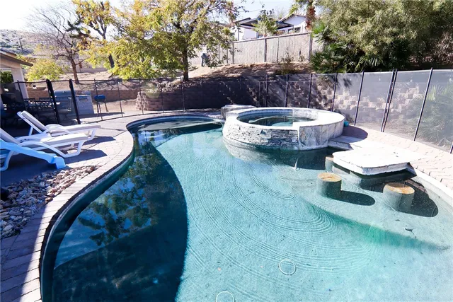 a view of a backyard with sitting area