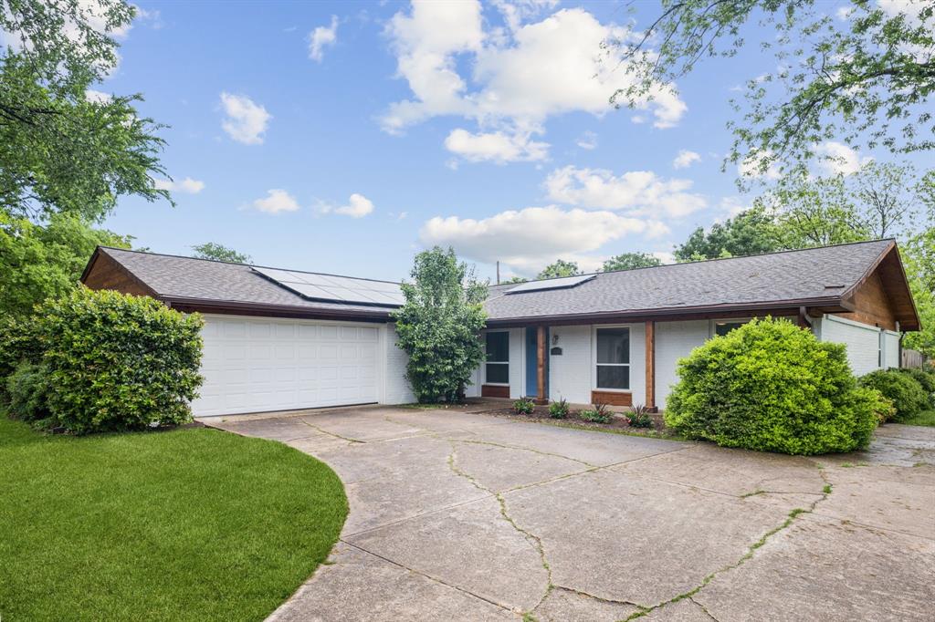12345 Band Dallas, TX 75244 - Photo 1 of 38 a front view of a house with garden