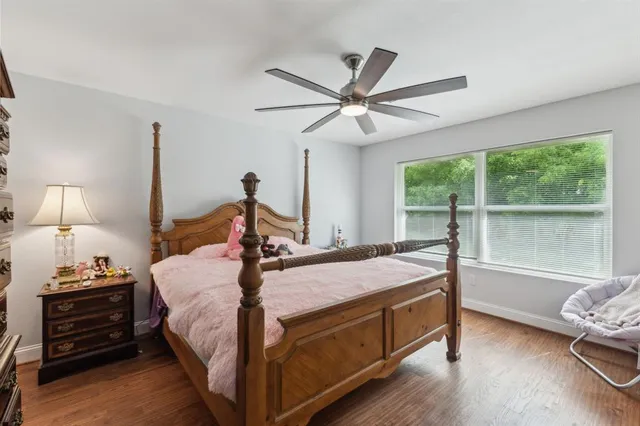 a bed room with a bed and a window