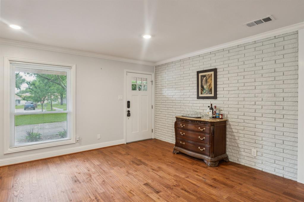 12345 Band Dallas, TX 75244 - Photo 28 of 38 a view of an empty room with wooden floor and a window