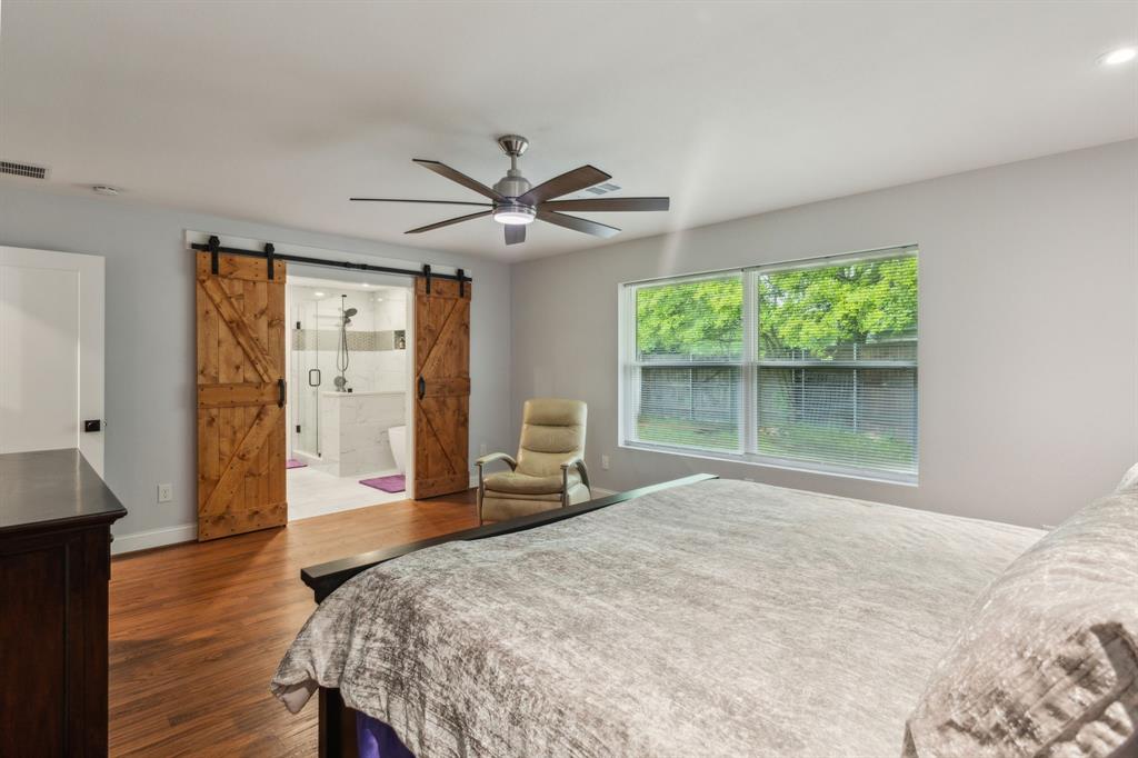 12345 Band Dallas, TX 75244 - Photo 7 of 38 a bedroom with a bed and a large window