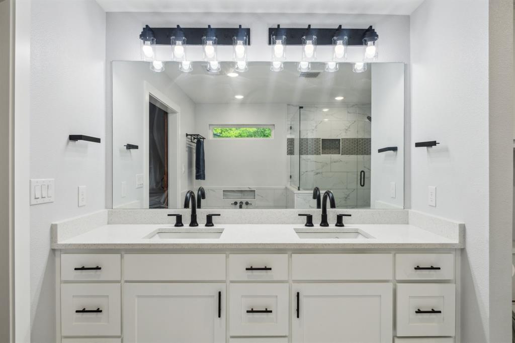 12345 Band Dallas, TX 75244 - Photo 10 of 38 a bathroom with double vanity sink and two mirror