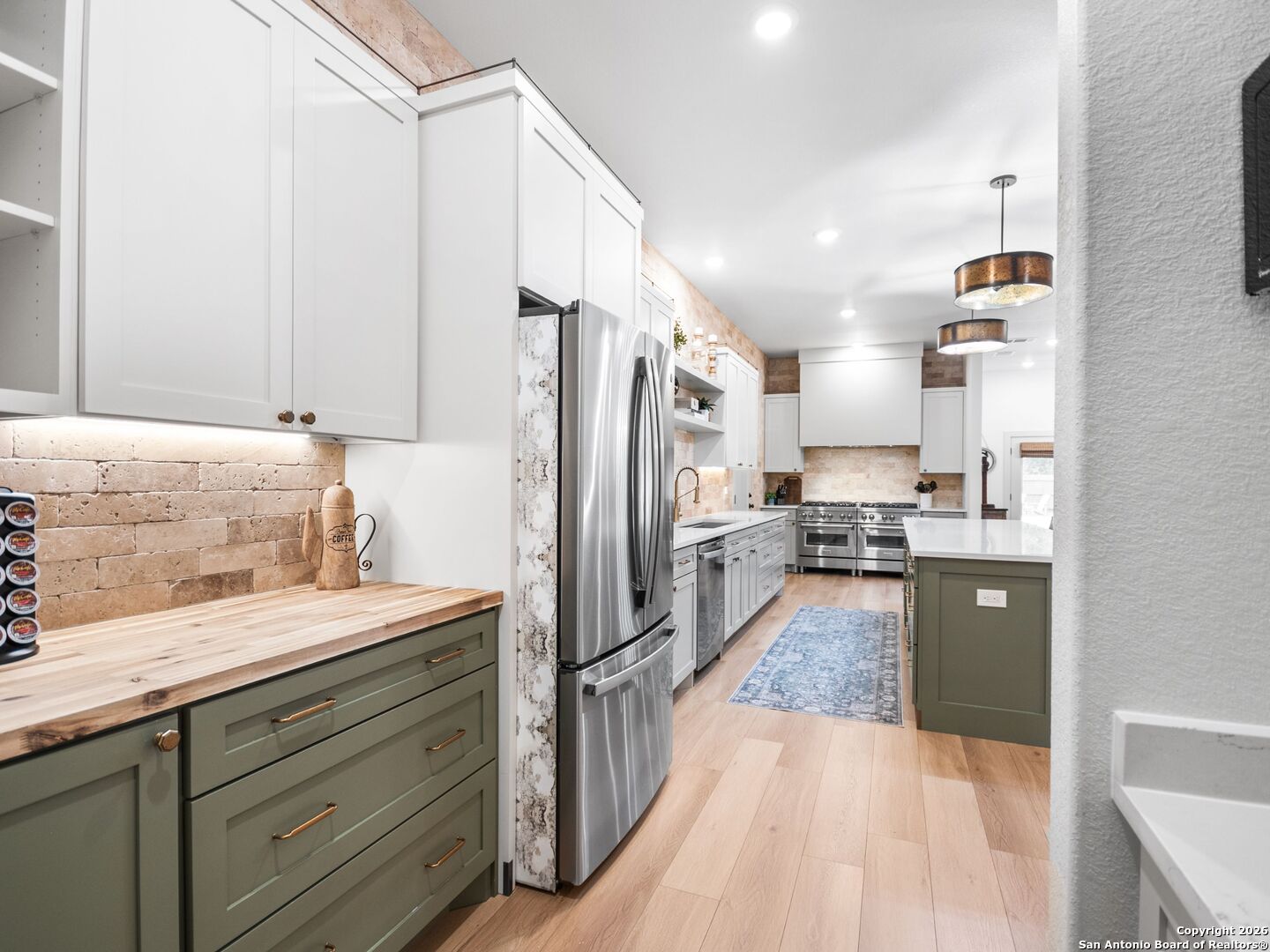 603 Graham Street Boerne, TX 78006 - Photo 15 of 42 a large kitchen with a center island appliances and cabinets