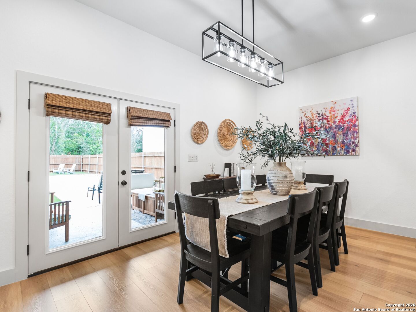 603 Graham Street Boerne, TX 78006 - Photo 23 of 42 a view of a dining room with furniture wooden floor and chandelier