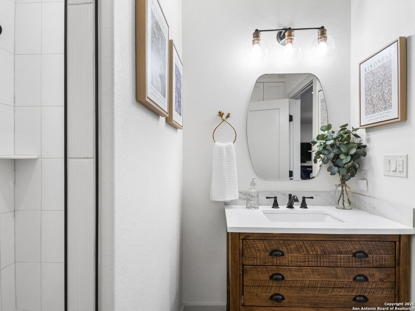 603 Graham Street Boerne, TX 78006 - Photo 25 of 42 a bathroom with a sink and a mirror