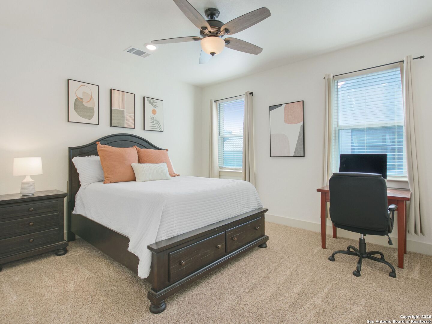 603 Graham Street Boerne, TX 78006 - Photo 32 of 42 a bedroom with a bed a table and chair