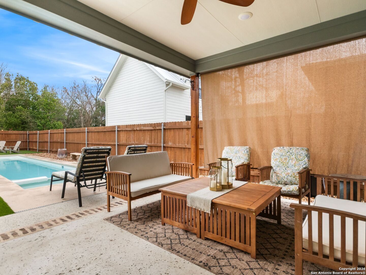603 Graham Street Boerne, TX 78006 - Photo 7 of 42 a balcony with furniture and a book shelf