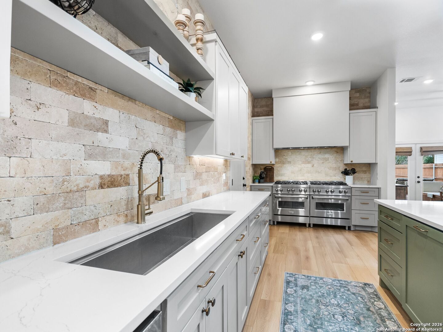 603 Graham Street Boerne, TX 78006 - Photo 8 of 42 a kitchen with stainless steel appliances a sink stove and cabinets