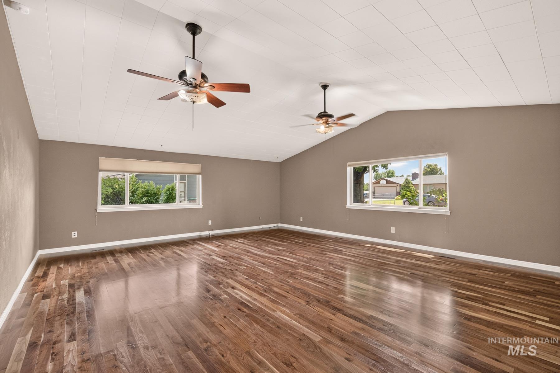 9622 Delaware Street Boise, ID 83709 - Photo 20 of 48 Spacious interior featuring wood-finish flooring, vaulted ceilings, and two ceiling fans