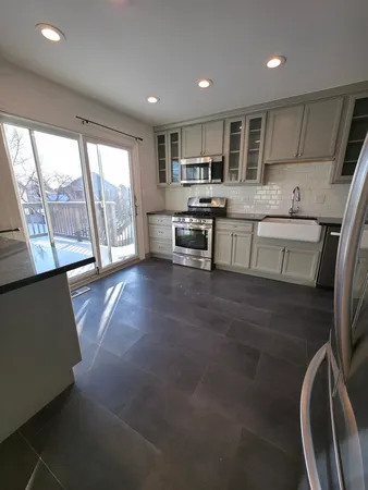 a view of deck with wooden floor and fence and a floor to ceiling window