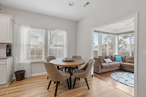 a bathroom with a toilet a sink a mirror and vanity