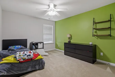 a view of a chairs and tables in the back yard of the house