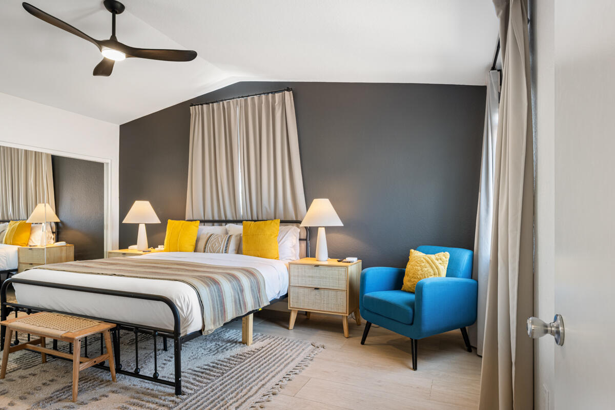 45640 Cimarron Road Indio, CA 92201 - Photo 11 of 28 a bedroom with a bed and wooden floor