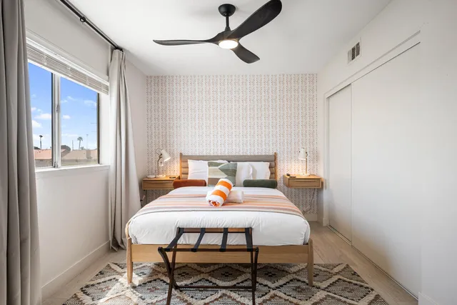 a bed room with a bed and furniture