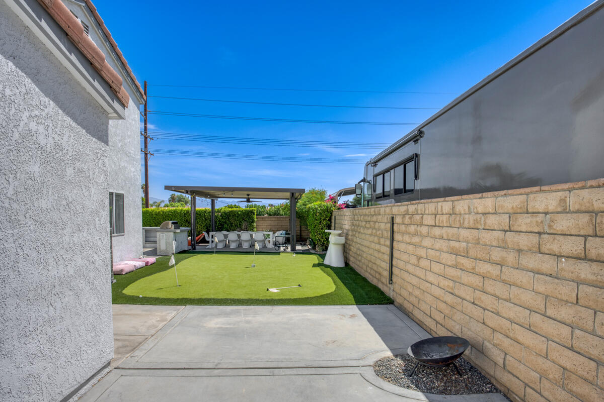 45640 Cimarron Road Indio, CA 92201 - Photo 21 of 28 a view of a backyard with a garden