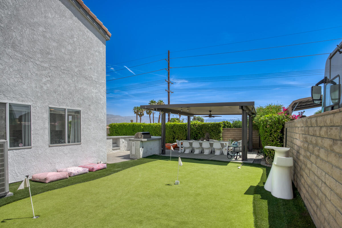 45640 Cimarron Road Indio, CA 92201 - Photo 22 of 28 a view of an chairs and tables in the patio