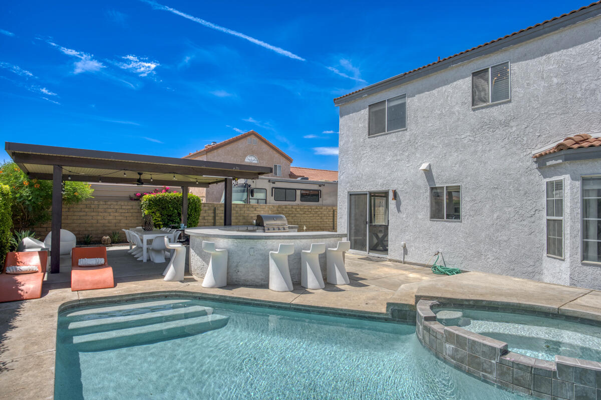 45640 Cimarron Road Indio, CA 92201 - Photo 25 of 28 a view of swimming pool with outdoor seating