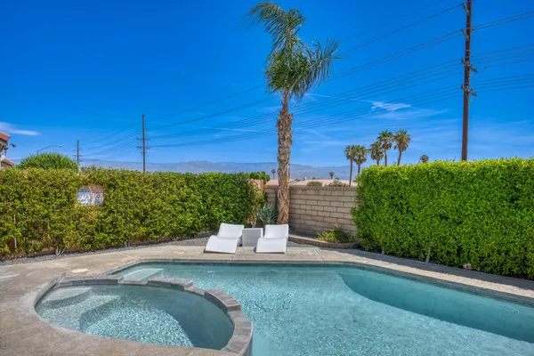 a view of a outdoor space with a house in the background