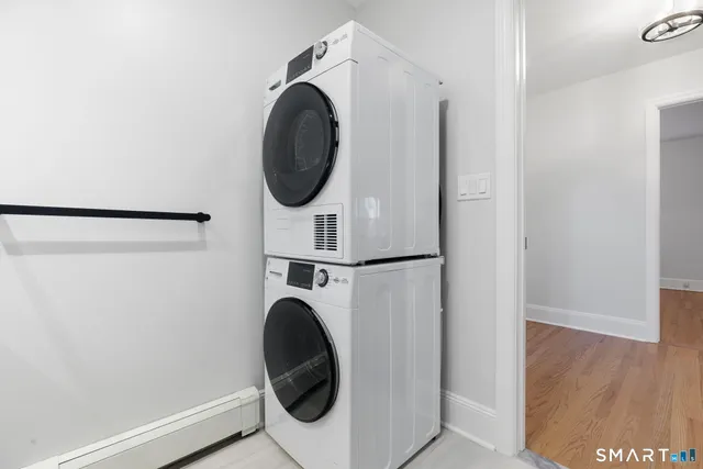 a close view of utility and utility room with washer and dryer
