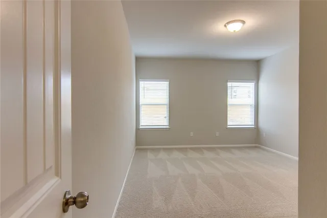 a view of room with window and closet area