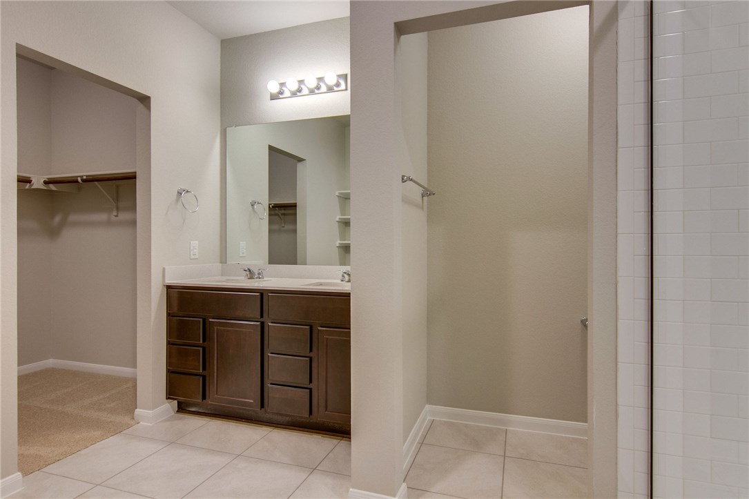 6916 Ranchito Drive Austin, TX 78744 - Photo 21 of 37 a bathroom with a sink and a mirror
