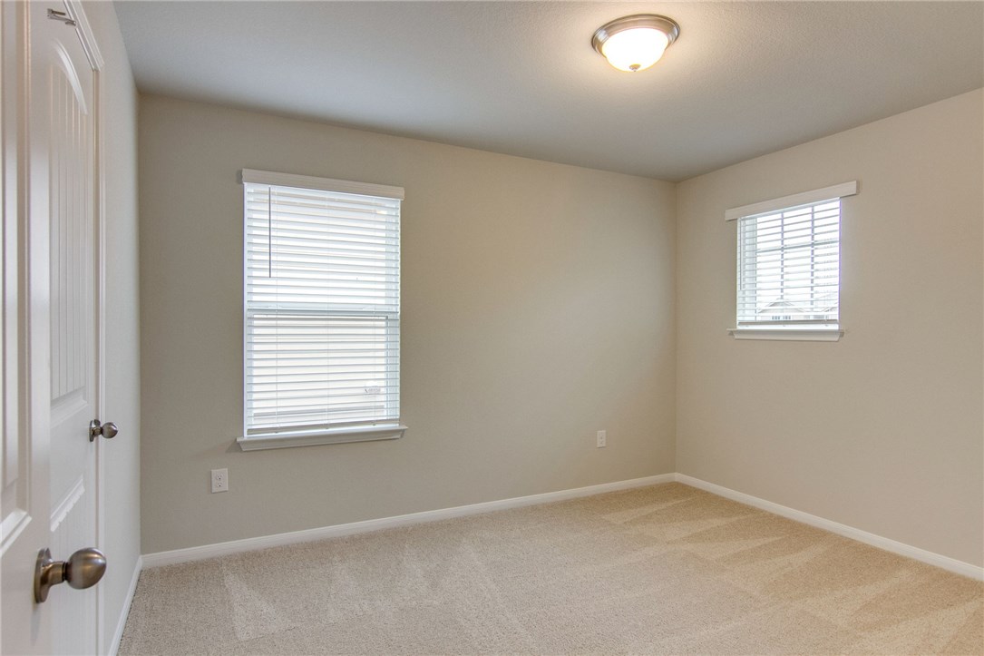 6916 Ranchito Drive Austin, TX 78744 - Photo 25 of 37 an empty room with a window
