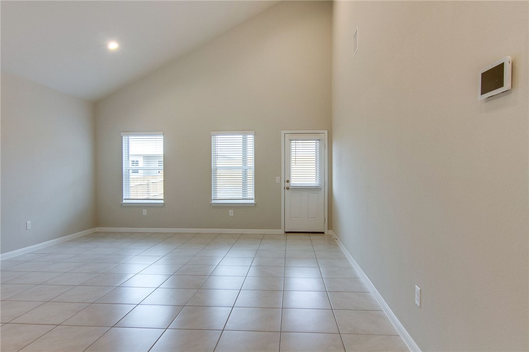 6916 Ranchito Drive Austin, TX 78744 - Photo 8 of 37 a view of an empty room with a window